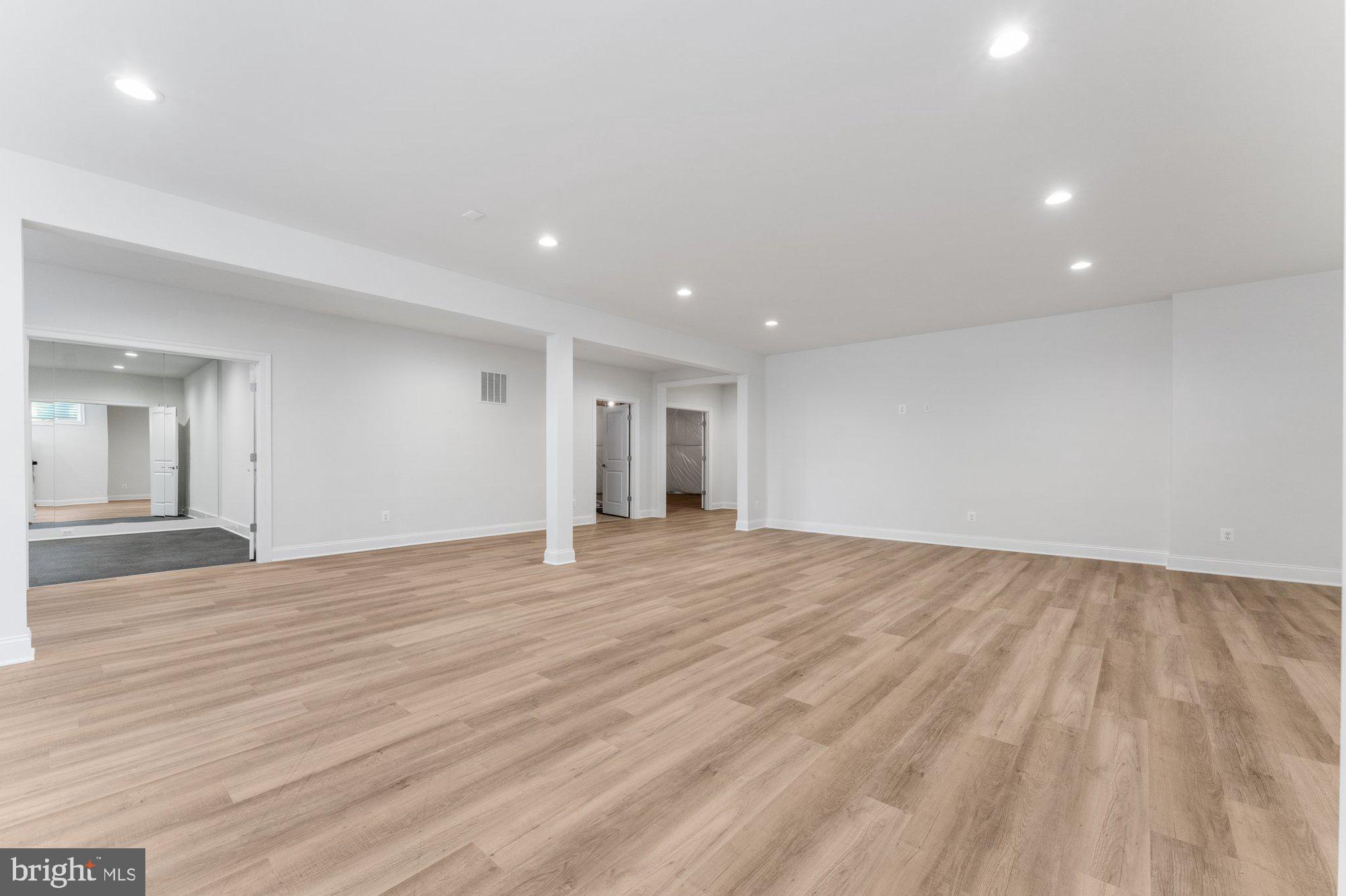 1767 Proffit Road Vienna, VA 22182 - Photo 88 of 117 a view of an empty room with wooden floor and a window