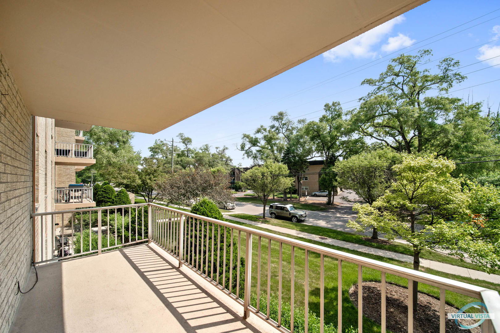 100 West Butterfield Road, Unit 210 Elmhurst, IL 60126 - Photo 12 of 27 a view of a balcony with wooden floor