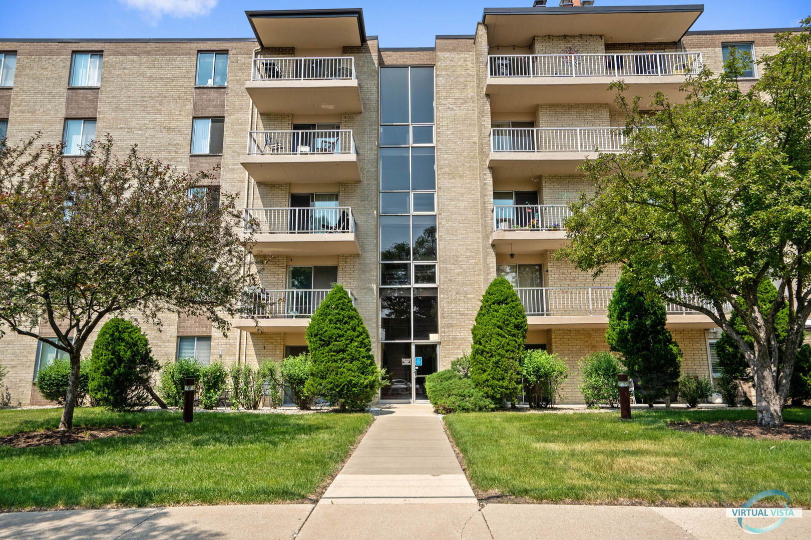100 West Butterfield Road, Unit 210 Elmhurst, IL 60126 - Photo 26 of 27 front view of building with a yard