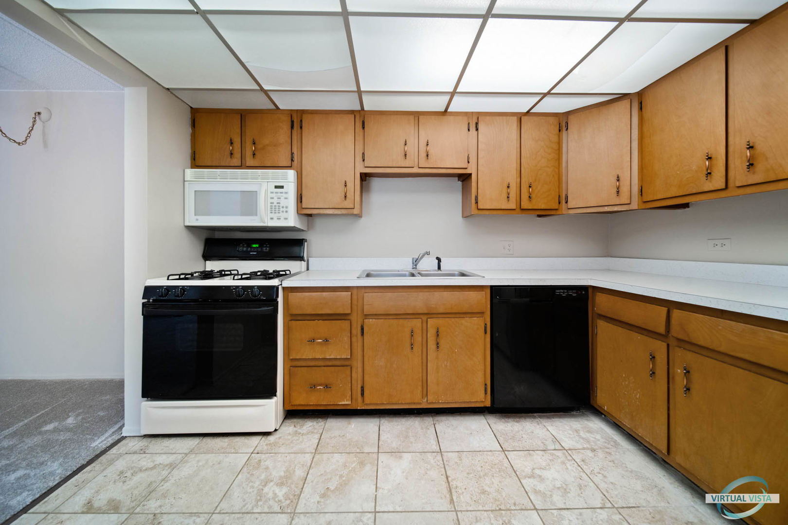 100 West Butterfield Road, Unit 210 Elmhurst, IL 60126 - Photo 6 of 27 a kitchen with stainless steel appliances granite countertop a stove a sink and a microwave