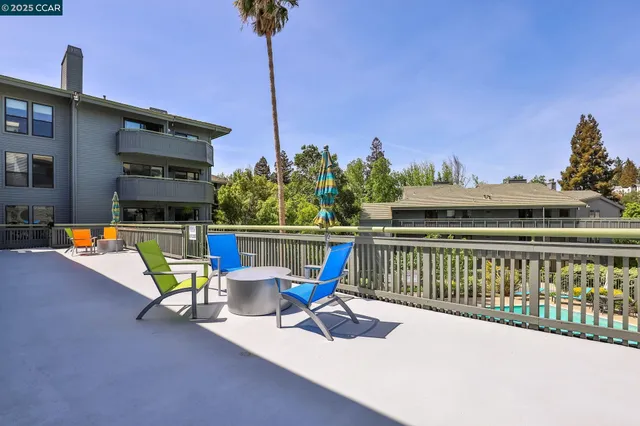 a view of a swimming pool with a lounge chairs
