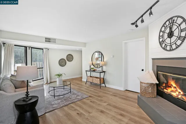 a view of a livingroom with furniture and a fireplace