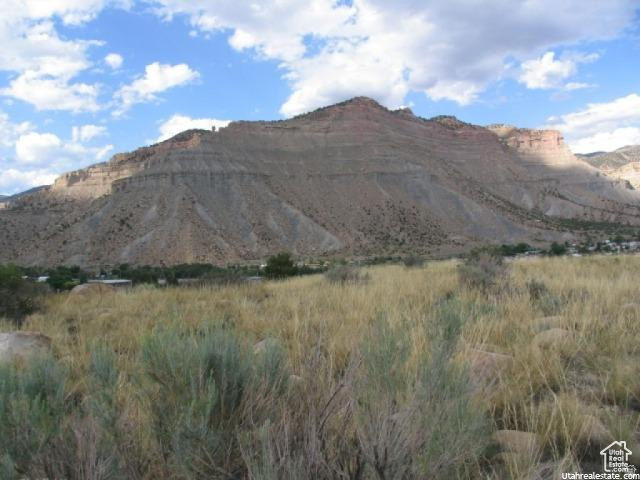 700 Spring Canyon Road Helper, UT 84526 - Photo 11 of 19 Expansive natural landscape featuring a large mountain backdrop and a foreground of dry grasses and brush