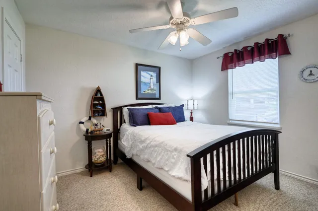 a bedroom with a bed and a dresser