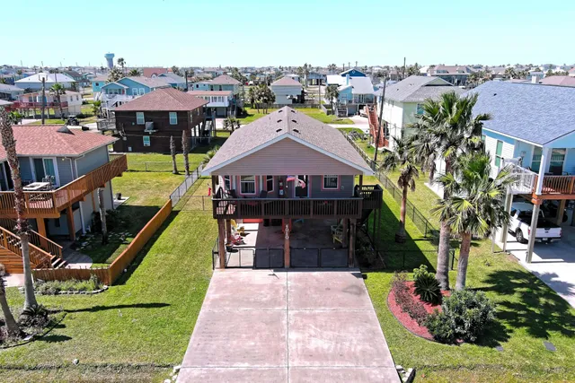 an aerial view of a house with a garden