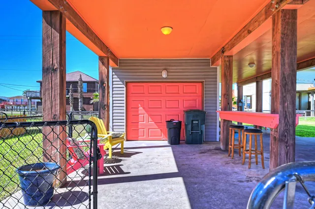 a front view of a house with outdoor seating and a potted plant