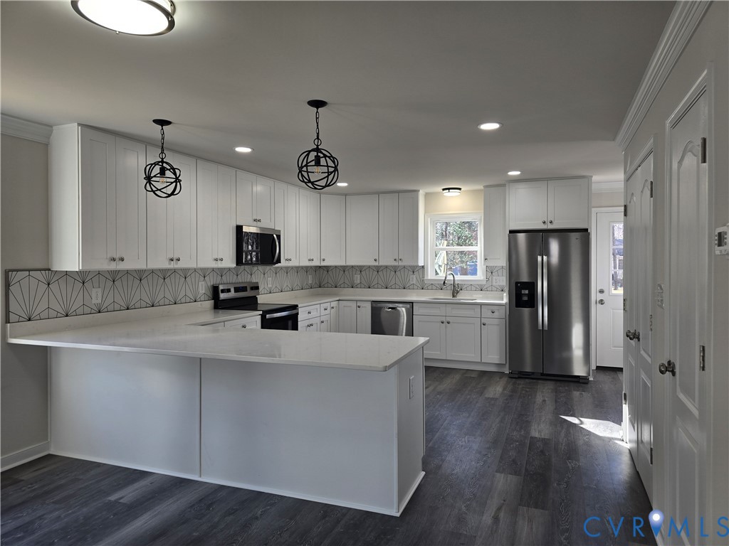 12084 Red Pine Road Ruther Glen, VA 22546 - Photo 11 of 49 Kitchen featuring white cabinetry, crown molding,