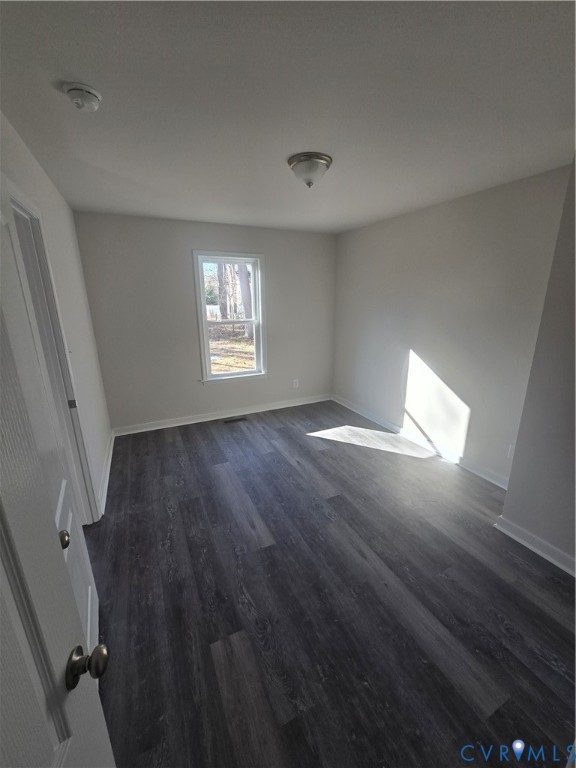 12084 Red Pine Road Ruther Glen, VA 22546 - Photo 16 of 49 Spare room featuring dark wood-style flooring and