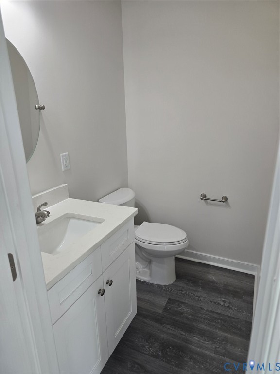 12084 Red Pine Road Ruther Glen, VA 22546 - Photo 20 of 49 Bathroom featuring vanity and dark wood-type floor