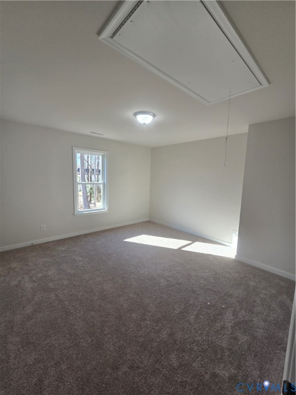 12084 Red Pine Road Ruther Glen, VA 22546 - Photo 46 of 49 Spare room featuring attic access and dark carpet