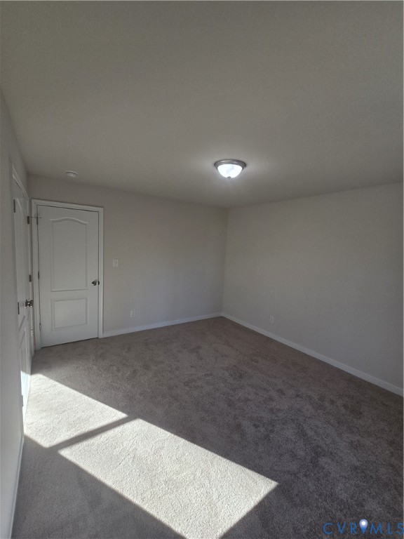 12084 Red Pine Road Ruther Glen, VA 22546 - Photo 47 of 49 Unfurnished room with carpet flooring and baseboar