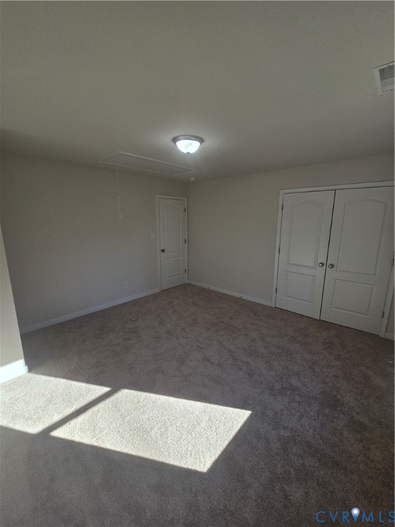 12084 Red Pine Road Ruther Glen, VA 22546 - Photo 49 of 49 Carpeted spare room with attic access and baseboar