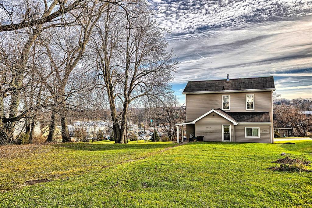 11189 Old Trail Road Irwin, PA 15642 - Photo 19 of 21 a front view of house with yard and green space