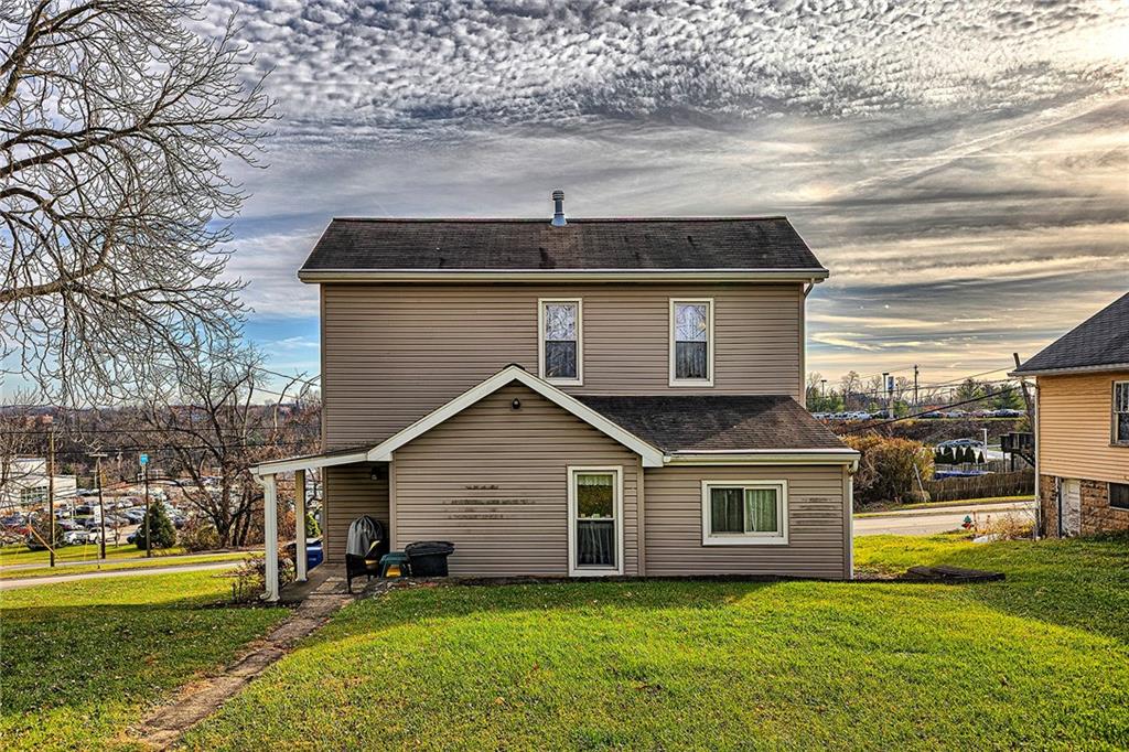 11189 Old Trail Road Irwin, PA 15642 - Photo 20 of 21 a front view of a house with a yard