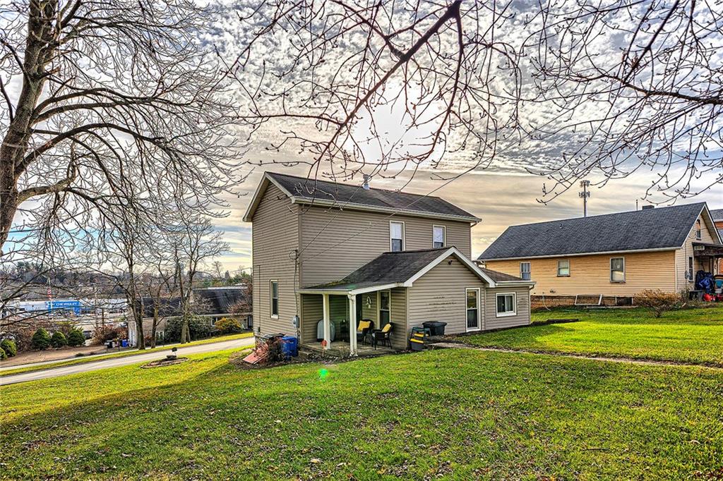 11189 Old Trail Road Irwin, PA 15642 - Photo 21 of 21 a view of a house with a big yard and large trees