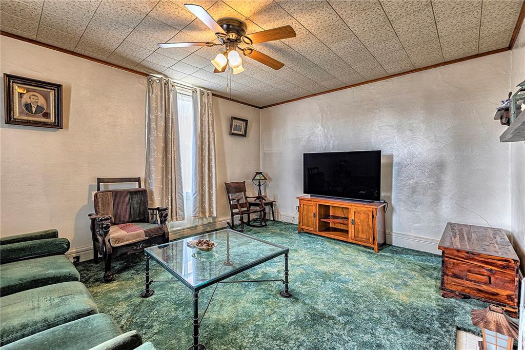 11189 Old Trail Road Irwin, PA 15642 - Photo 5 of 21 a living room with furniture and a flat screen tv