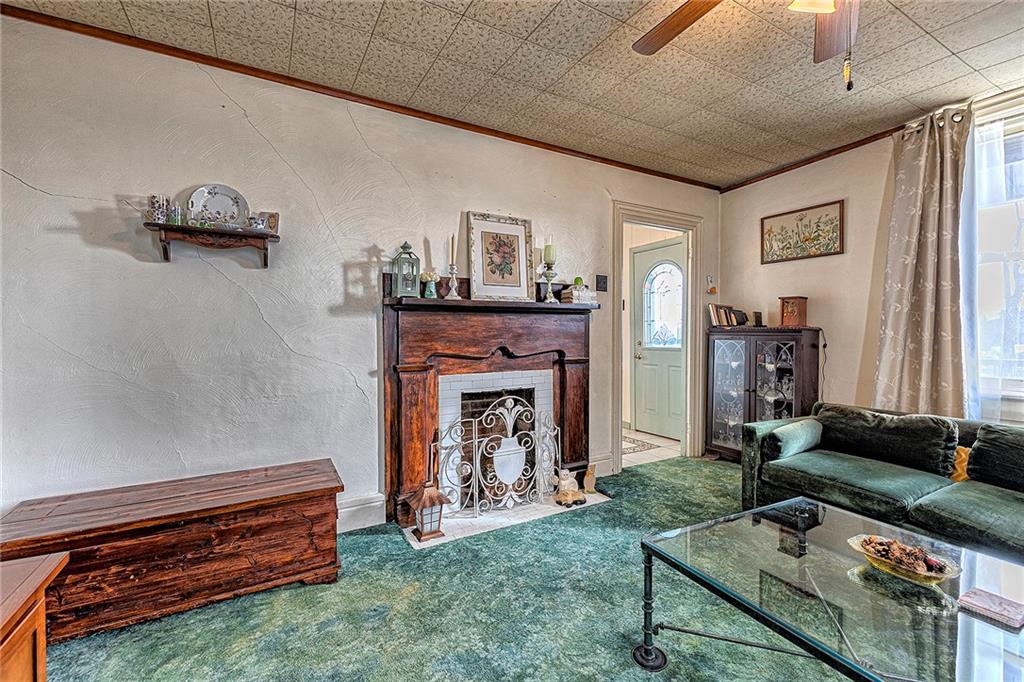 11189 Old Trail Road Irwin, PA 15642 - Photo 6 of 21 a living room with furniture and a fireplace