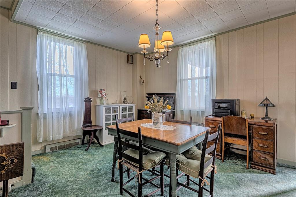 11189 Old Trail Road Irwin, PA 15642 - Photo 8 of 21 a view of a dining room with furniture and a chandelier