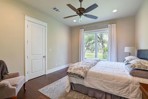 a bedroom with a large bed and a window