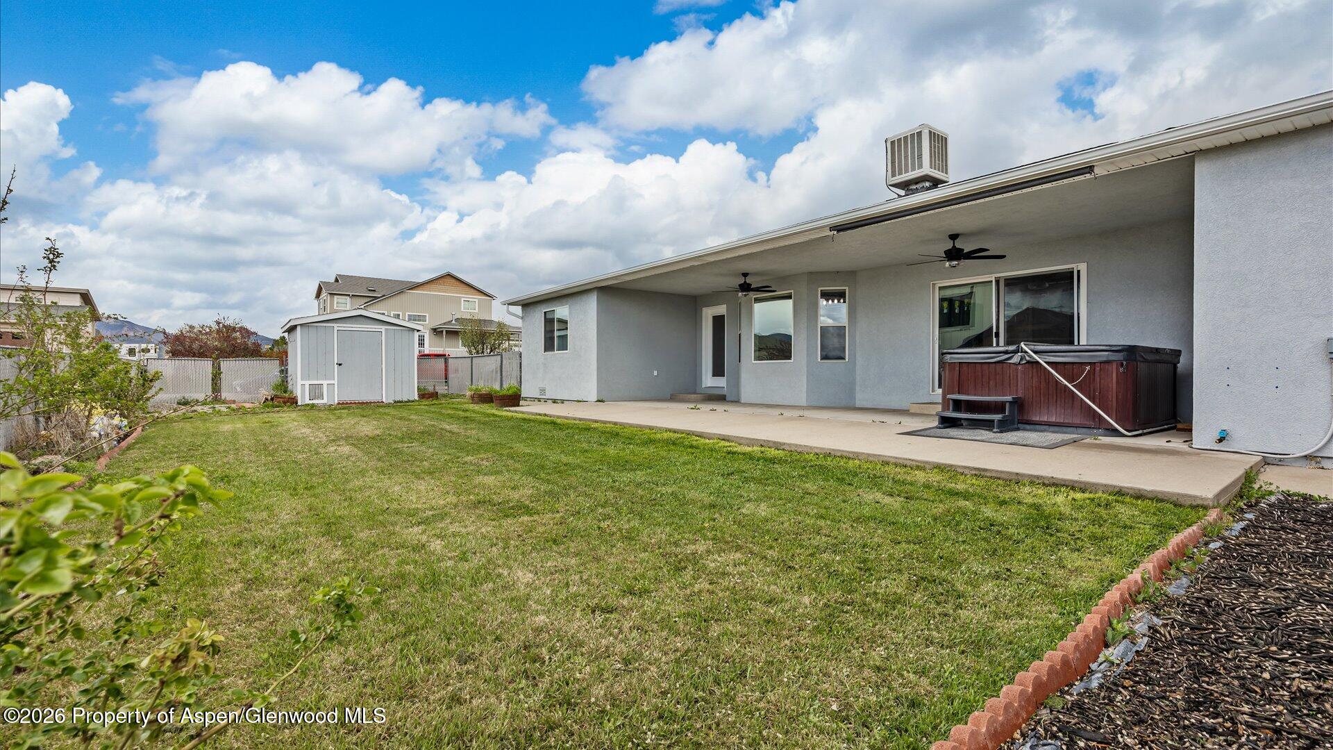 1459 Anvil View Avenue Rifle, CO 81650 - Photo 25 of 29 a front view of a house with a garden