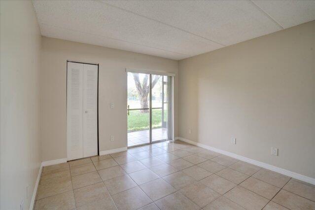 1104 Meadows Circle Boynton Beach, FL 33436 - Photo 20 of 27 an empty room with windows