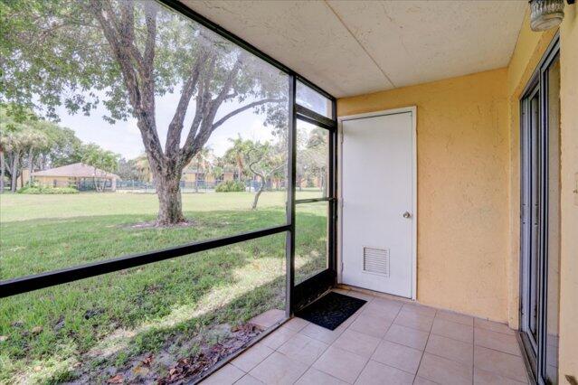 1104 Meadows Circle Boynton Beach, FL 33436 - Photo 24 of 27 a view of porch with a big yard