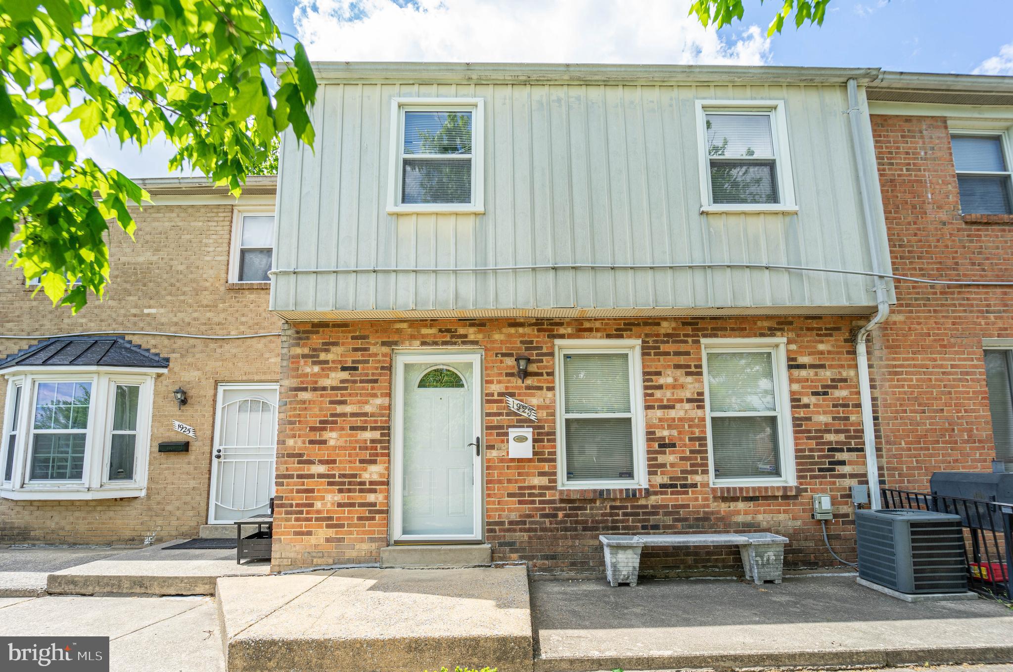 1923 Addison Road South District Heights, MD 20747 - Photo 1 of 30 front view of a brick house with many windows