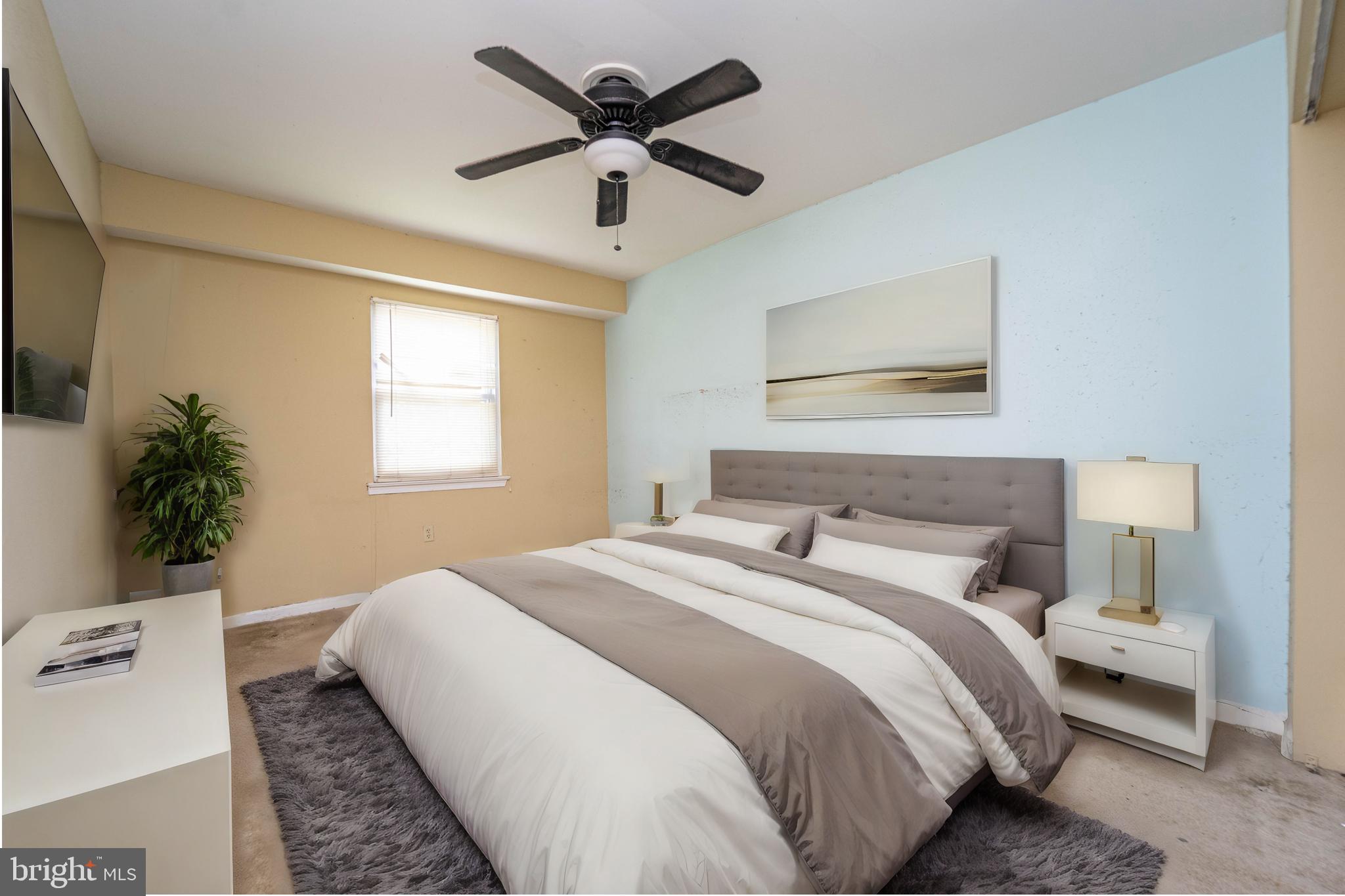 1923 Addison Road South District Heights, MD 20747 - Photo 15 of 30 a bedroom with a large bed and a window