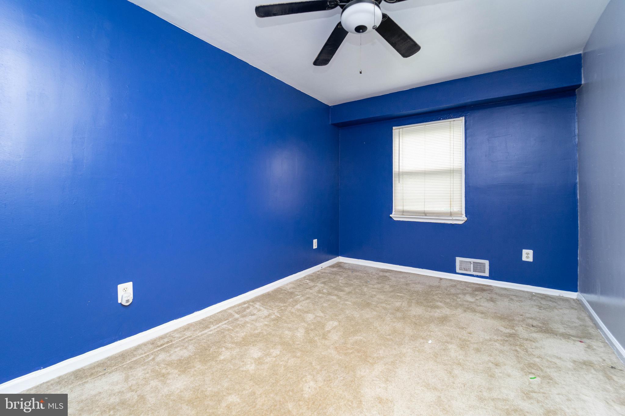 1923 Addison Road South District Heights, MD 20747 - Photo 20 of 30 a view of a room with a ceiling fan and a window