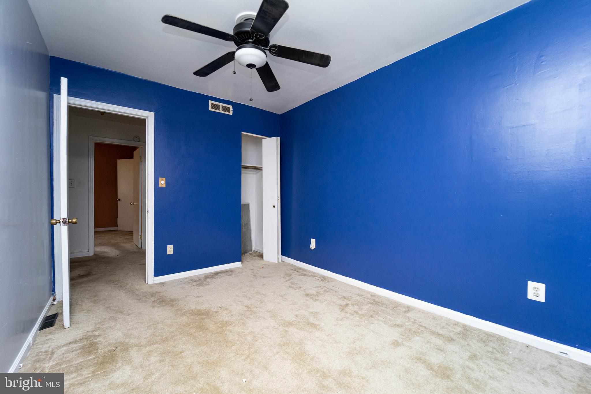 1923 Addison Road South District Heights, MD 20747 - Photo 21 of 30 a view of a livingroom with a ceiling fan and closet