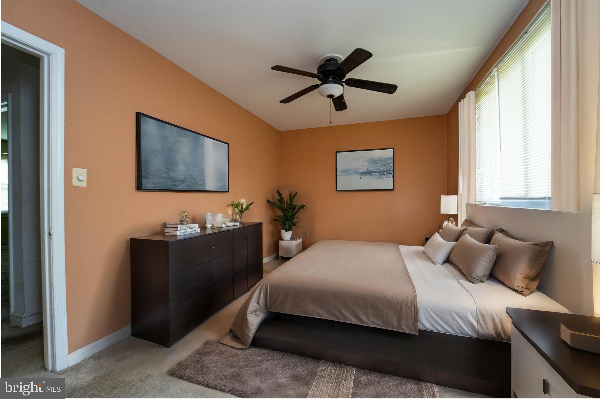 1923 Addison Road South District Heights, MD 20747 - Photo 23 of 30 a bedroom with a bed and a painting on the wall