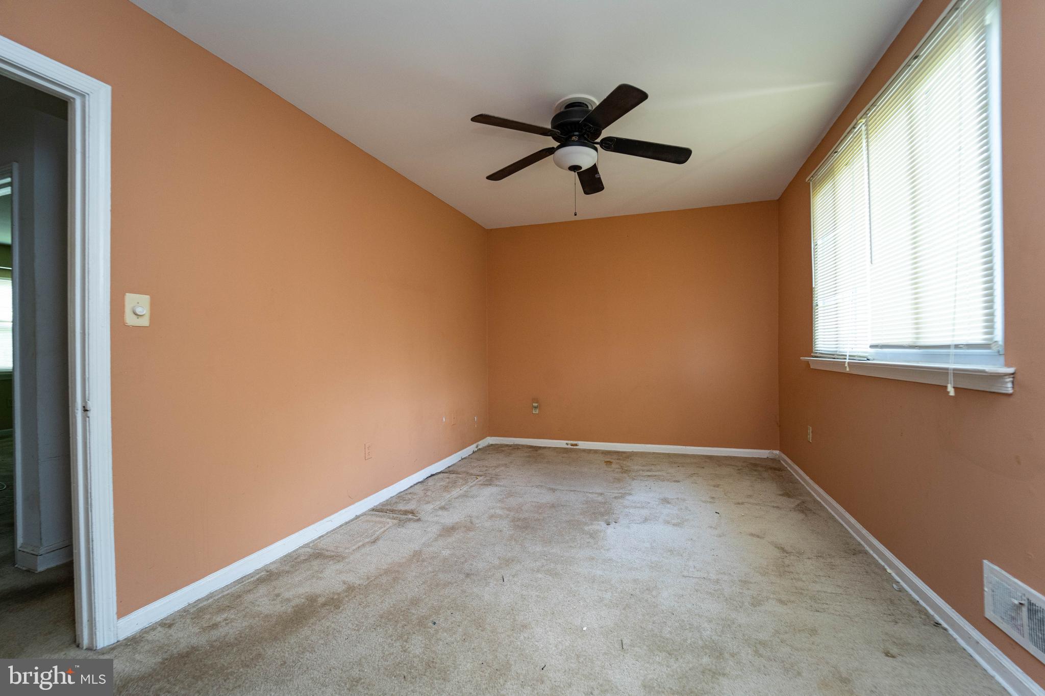 1923 Addison Road South District Heights, MD 20747 - Photo 24 of 30 an empty room with a window and a fan