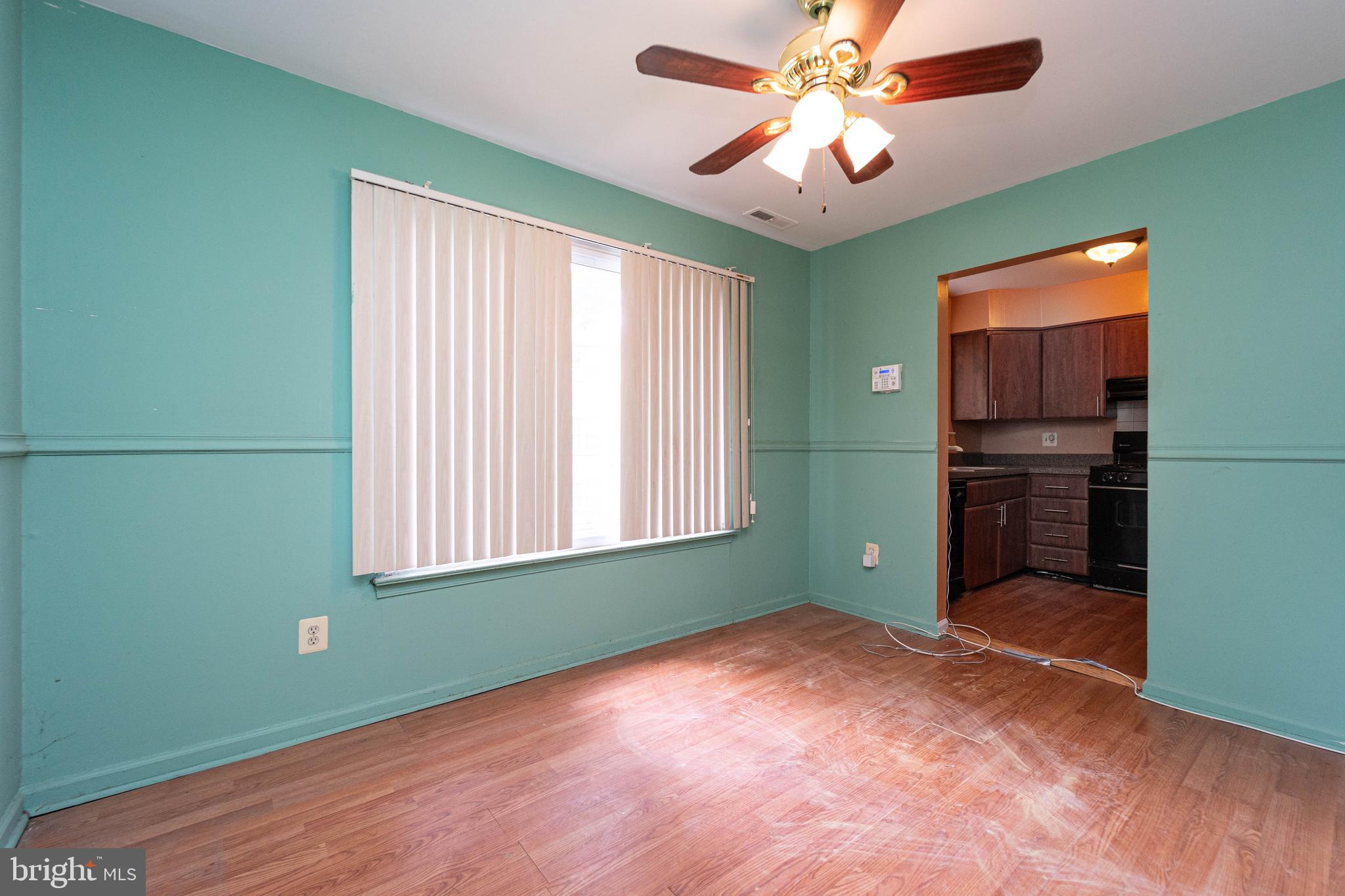 1923 Addison Road South District Heights, MD 20747 - Photo 10 of 30 a view of empty room with window and ceiling fan