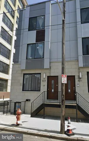 a view of a building with car parked