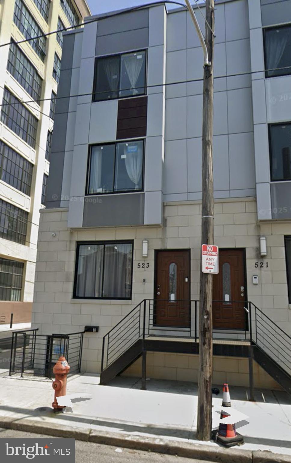 a view of a building with car parked