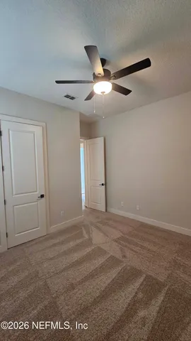 a view of a room with stairs and windows