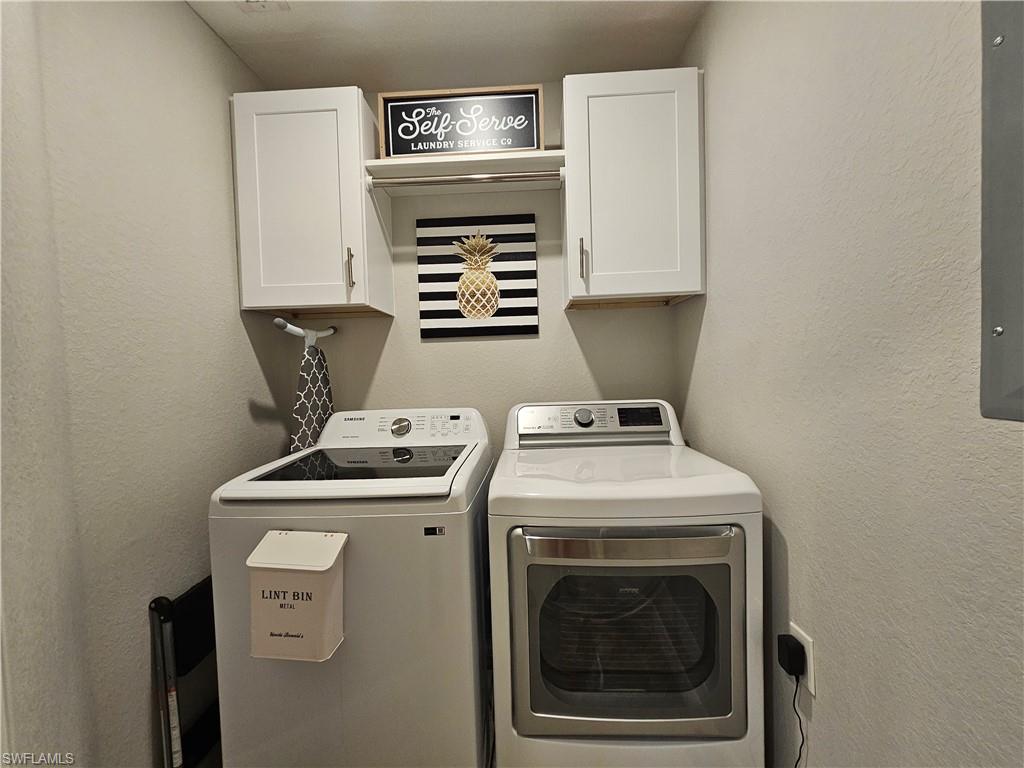 9596 Trevi Court, Unit 5428 Naples, FL 34113 - Photo 18 of 43 a view of washer and dryer with washer