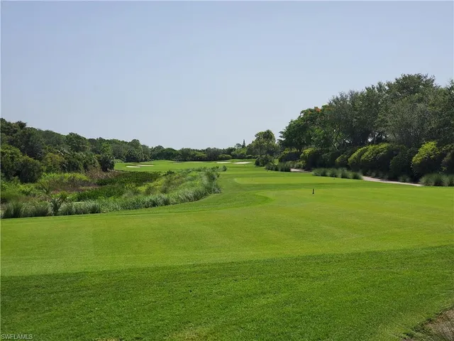 a view of a golf course with a lake