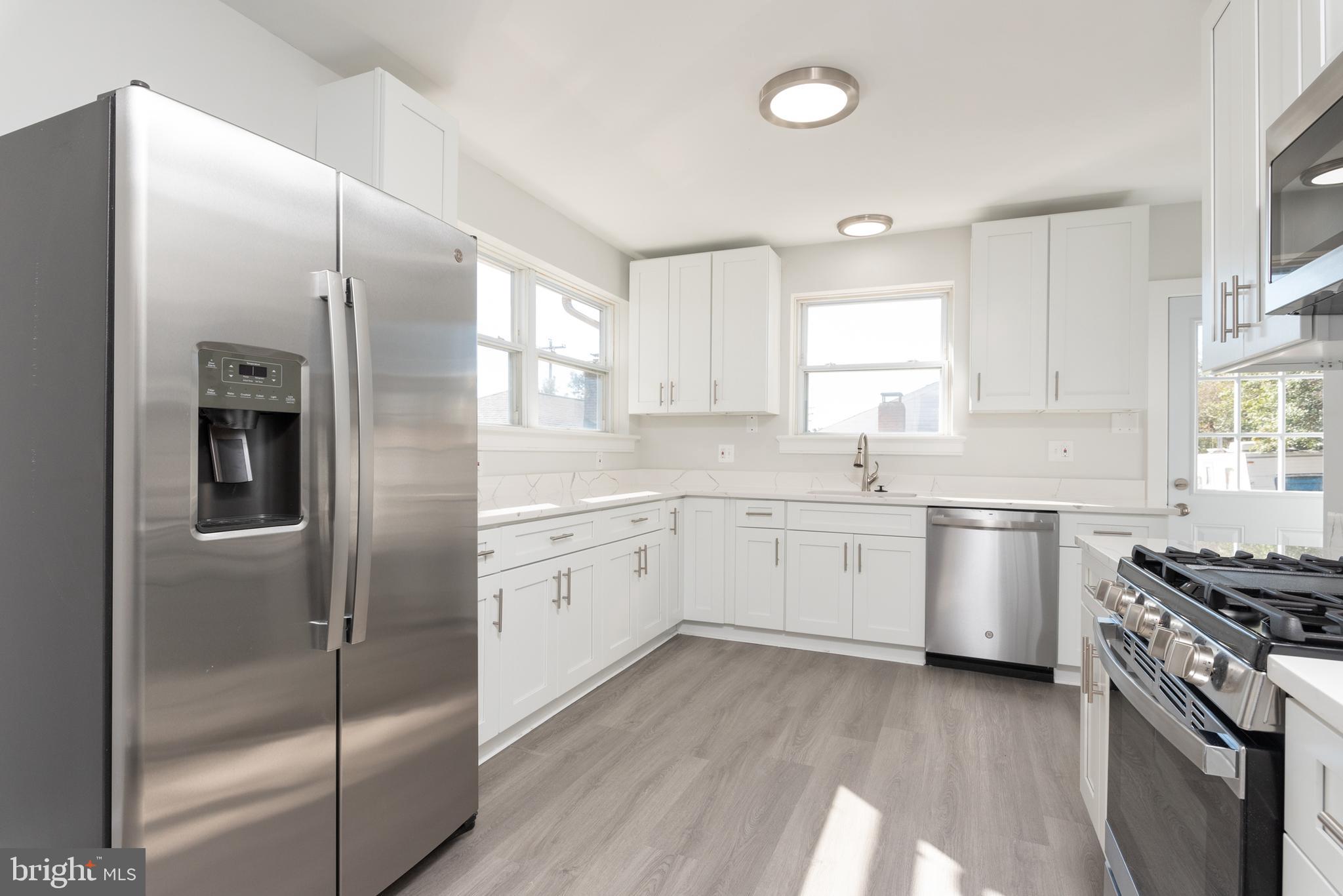3306 East River Road Petersburg, VA 23803 - Photo 11 of 31 a kitchen with a refrigerator stove and sink