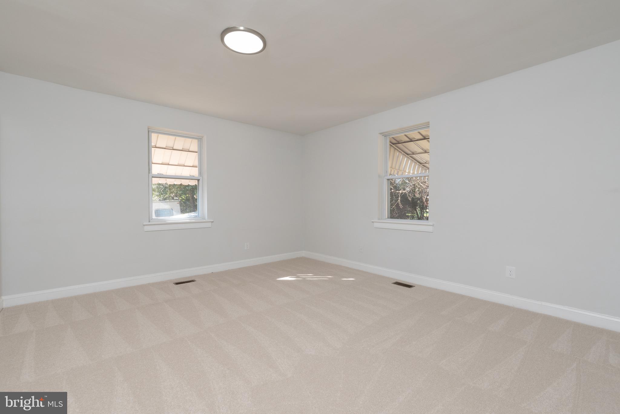 3306 East River Road Petersburg, VA 23803 - Photo 13 of 31 an empty room with windows