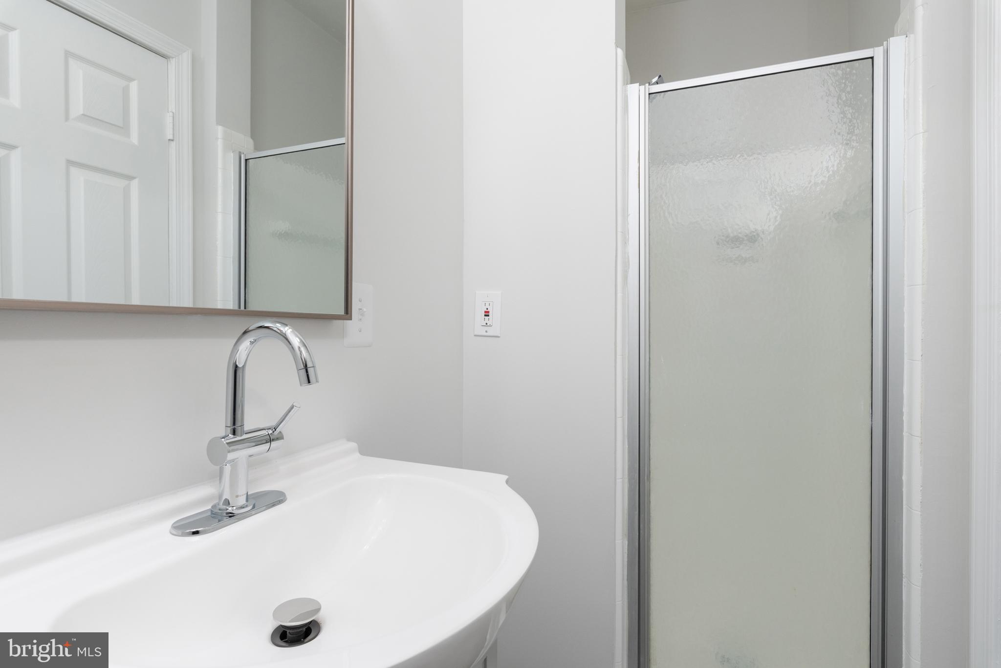3306 East River Road Petersburg, VA 23803 - Photo 17 of 31 a bathroom with a sink and a mirror