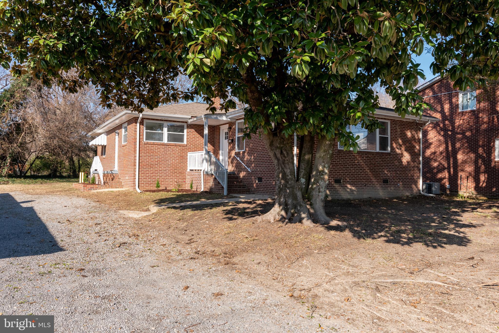 3306 East River Road Petersburg, VA 23803 - Photo 2 of 31 a white house with a tree in the background