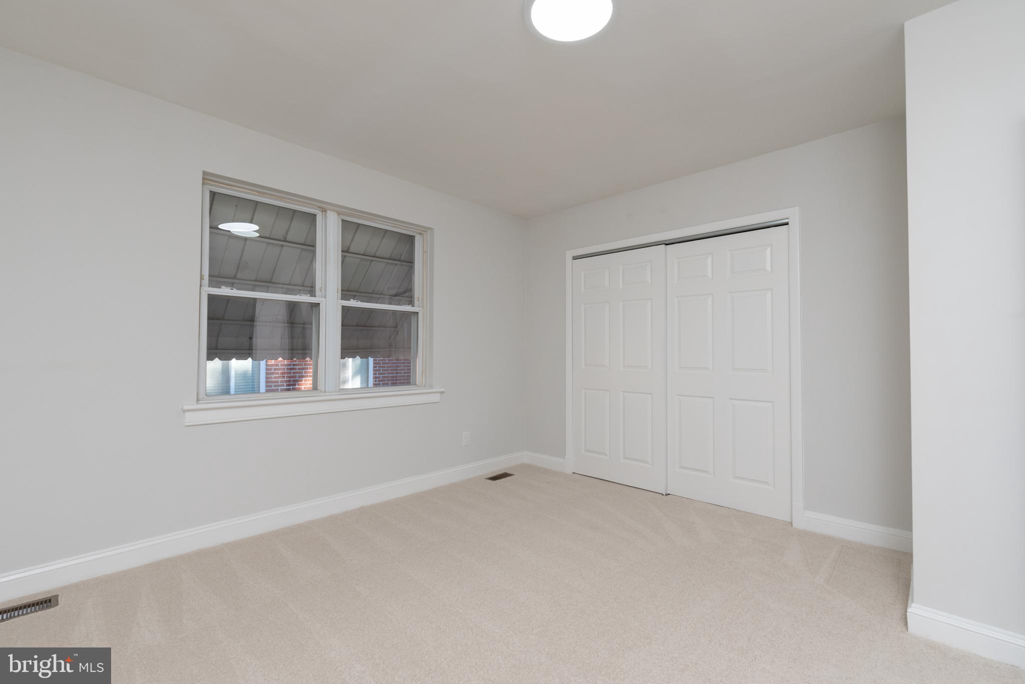3306 East River Road Petersburg, VA 23803 - Photo 21 of 31 a view of an empty room with a window