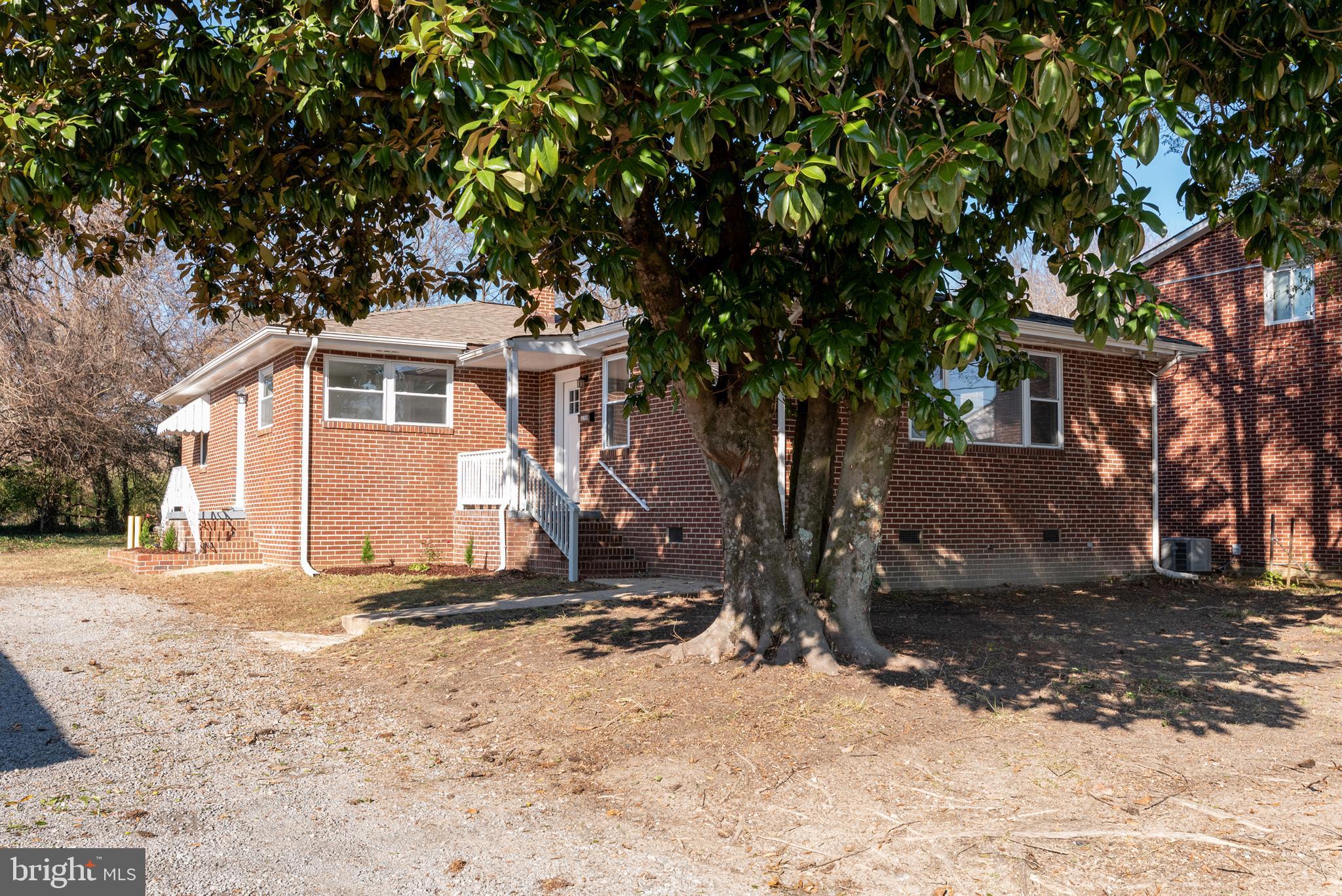 3306 East River Road Petersburg, VA 23803 - Photo 3 of 31 a front view of a house with a yard covered in snow