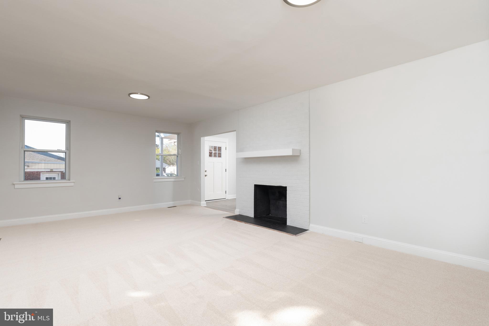 3306 East River Road Petersburg, VA 23803 - Photo 6 of 31 an empty room with fireplace