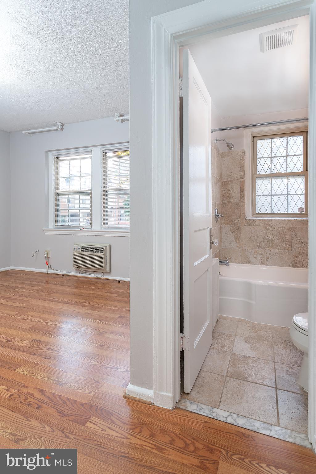 2415 Ontario Road Northwest, Unit 101 Washington, DC 20009 - Photo 12 of 22 a view of bathroom with bathtub and shower