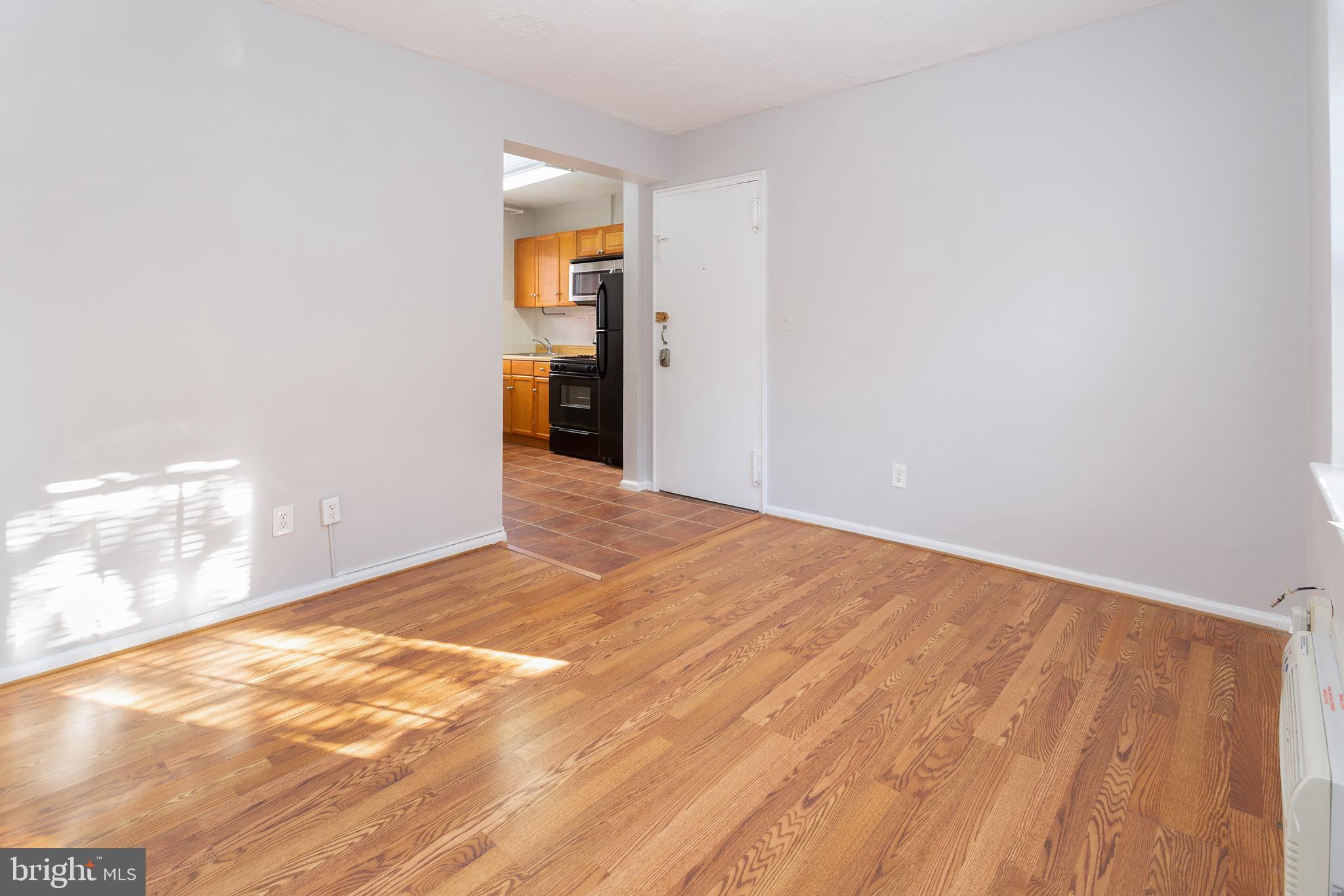 2415 Ontario Road Northwest, Unit 101 Washington, DC 20009 - Photo 5 of 22 a view of an empty room and window