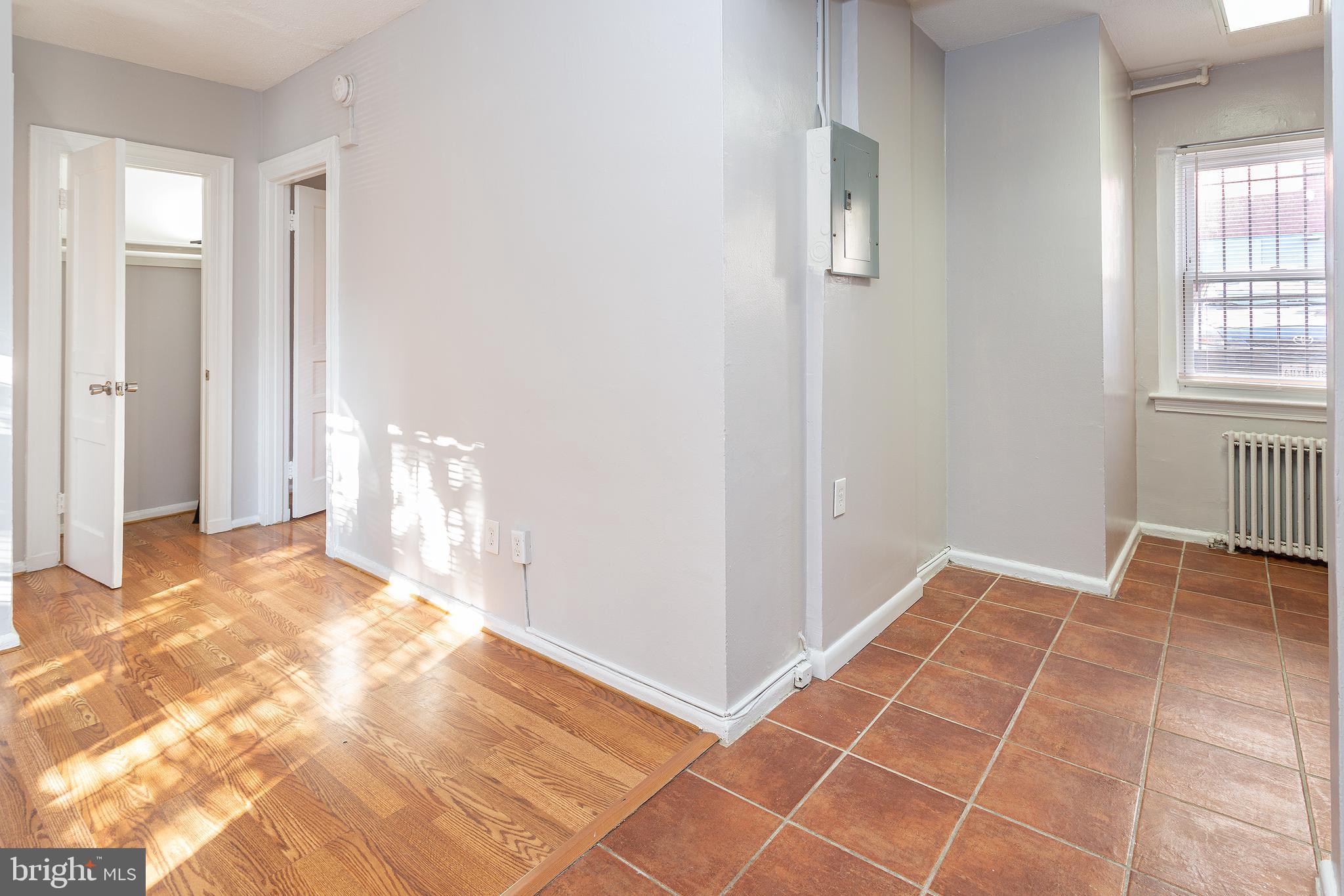 2415 Ontario Road Northwest, Unit 101 Washington, DC 20009 - Photo 9 of 22 a view of an empty room and window