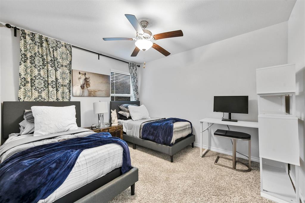 226 County Road 4869 Azle, TX 76020 - Photo 9 of 28 a bedroom with two beds and a ceiling fan