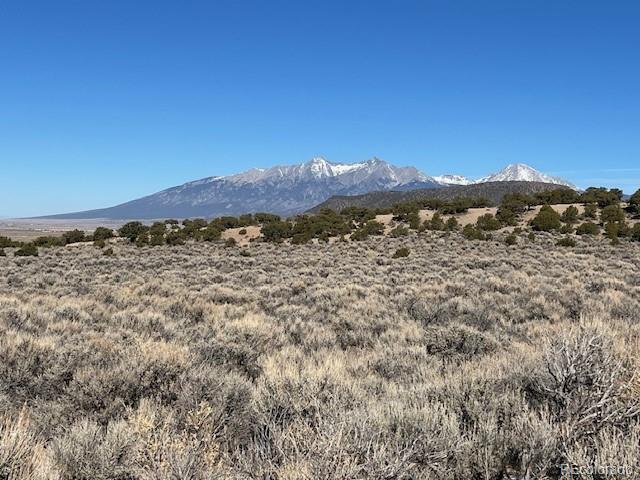Lot 1188 Fleck Road Fort Garland, CO 81133 - Photo 1 of 14 a view of a road with a building in the background